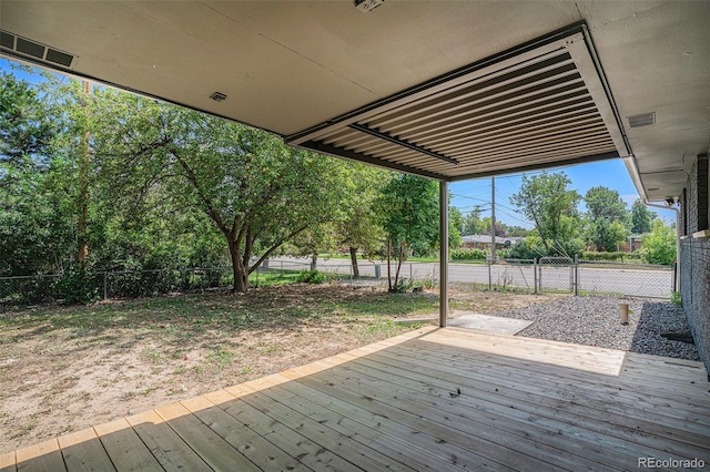 deck featuring a fenced backyard and visible vents