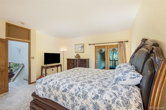 carpeted bedroom featuring access to outside