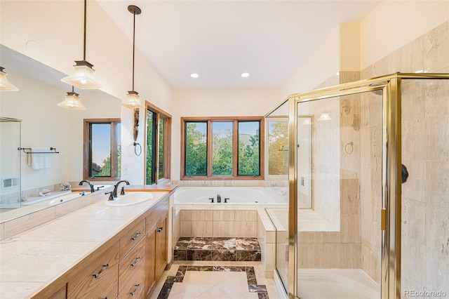 full bathroom featuring a shower stall, a garden tub, and vanity