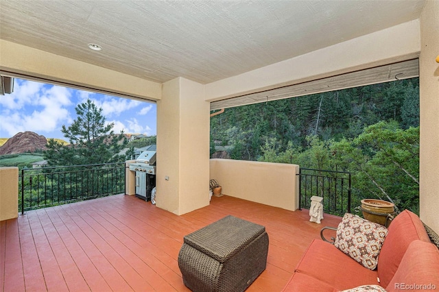 wooden deck with grilling area