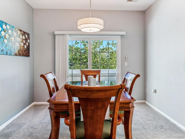 dining space featuring carpet floors