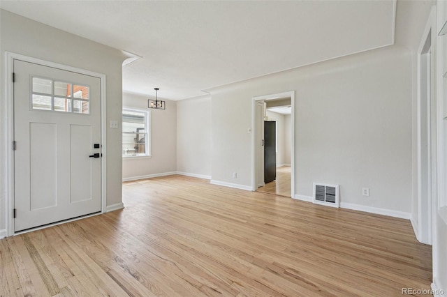 2709 S Franklin St, Denver, CO 80210 - foyer with light wood-style floors and baseboards