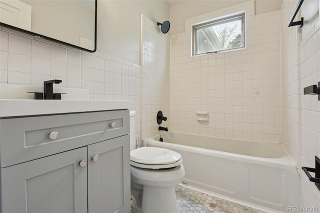 2709 S Franklin St, Denver, CO 80210 - full bathroom with tile walls, vanity, bathtub / shower combination, and tile patterned floors