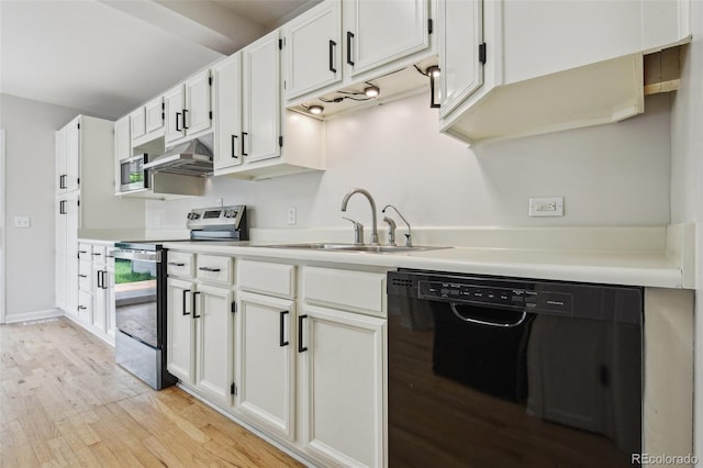 2709 S Franklin St, Denver, CO 80210 - kitchen featuring appliances with stainless steel finishes, light wood-style flooring, ventilation hood, and white cabinetry
