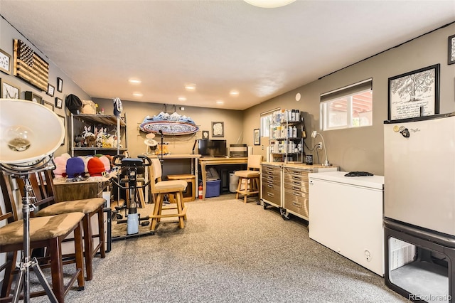 carpeted home office with recessed lighting