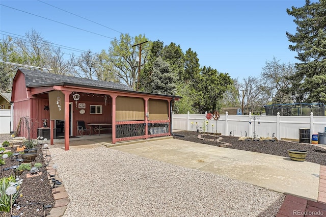 view of outdoor structure featuring fence