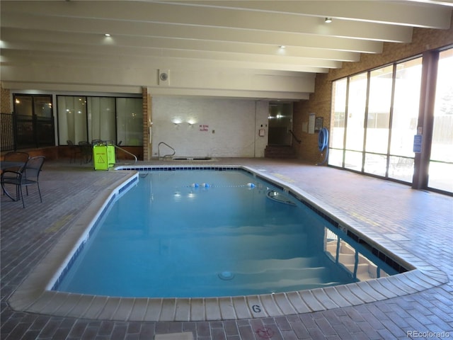 view of swimming pool featuring a jacuzzi