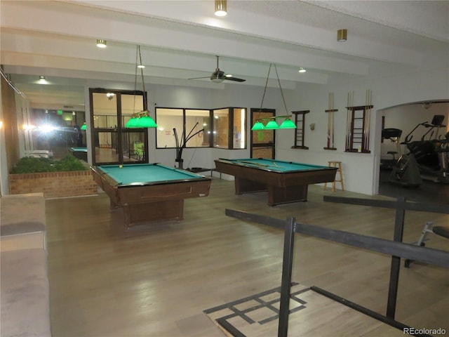 recreation room with ceiling fan, hardwood / wood-style flooring, beam ceiling, and pool table