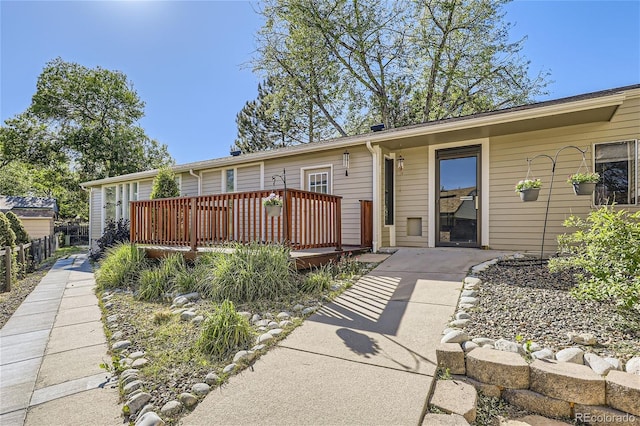 view of front of property featuring a wooden deck