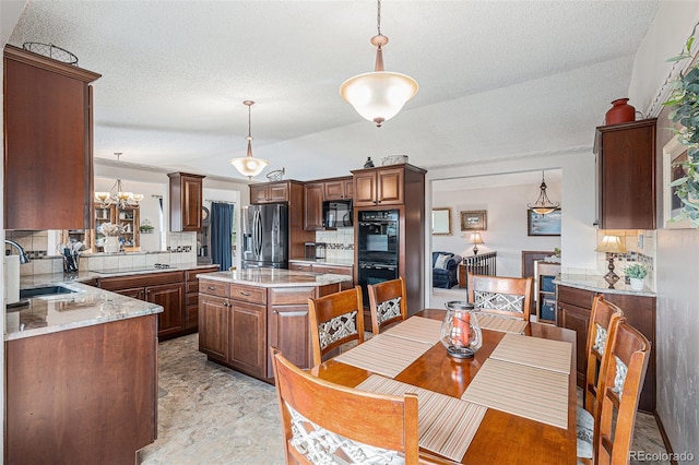 1095 Lake Woodmoor Dr, Monument, CO 80132 - dining room with a chandelier and a textured ceiling