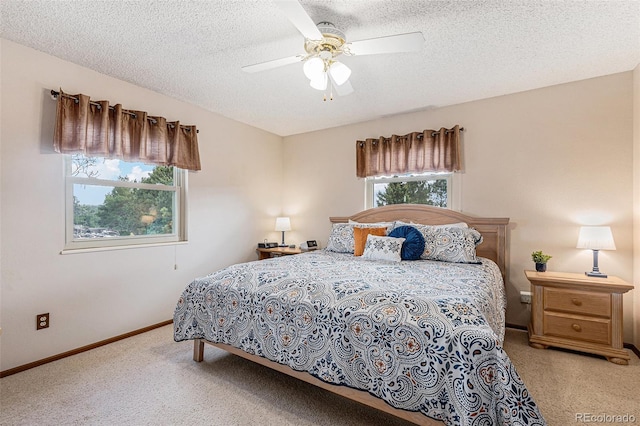 1095 Lake Woodmoor Dr, Monument, CO 80132 - carpeted bedroom with a textured ceiling, baseboards, and ceiling fan