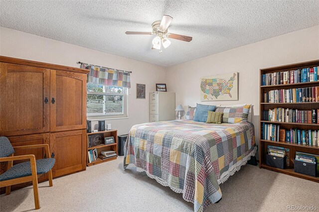 1095 Lake Woodmoor Dr, Monument, CO 80132 - bedroom featuring light colored carpet, a textured ceiling, and ceiling fan