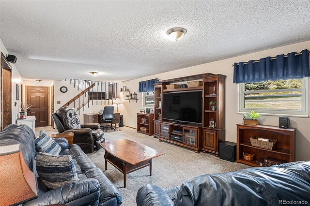 1095 Lake Woodmoor Dr, Monument, CO 80132 - carpeted living room with stairs and a textured ceiling