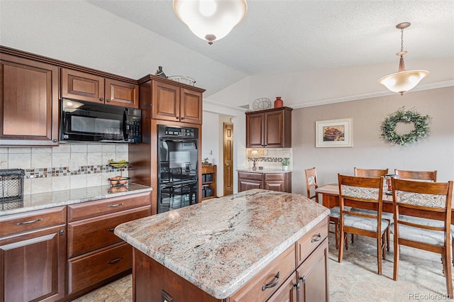 1095 Lake Woodmoor Dr, Monument, CO 80132 - kitchen with black appliances, backsplash, lofted ceiling, light stone countertops, and hanging light fixtures