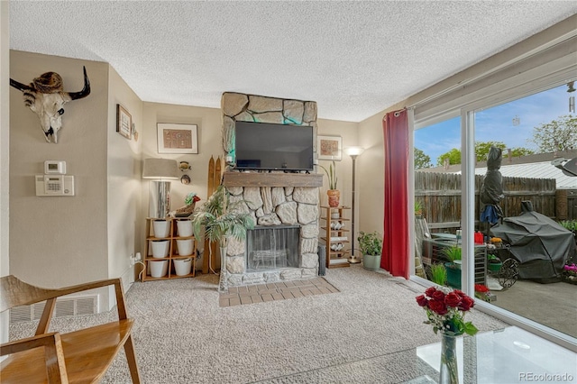 14034 E Utah Cir, Aurora, CO 80012 - carpeted living room with a fireplace and a textured ceiling