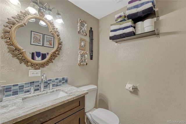 14034 E Utah Cir, Aurora, CO 80012 - half bathroom with toilet, vanity, and a textured wall