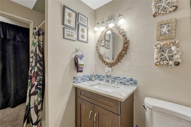 14034 E Utah Cir, Aurora, CO 80012 - full bathroom with toilet, vanity, and backsplash