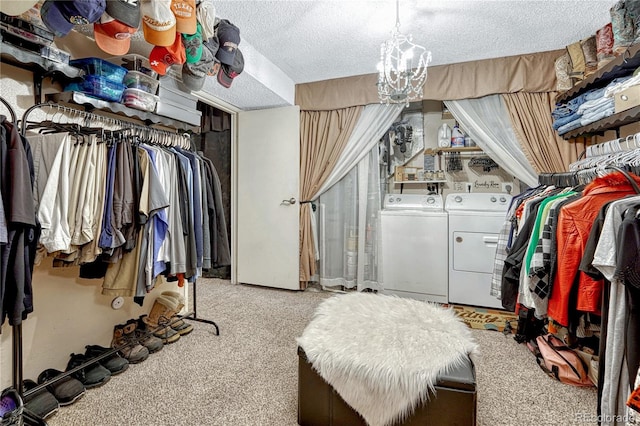 14034 E Utah Cir, Aurora, CO 80012 - walk in closet featuring washer and clothes dryer, carpet, and a chandelier