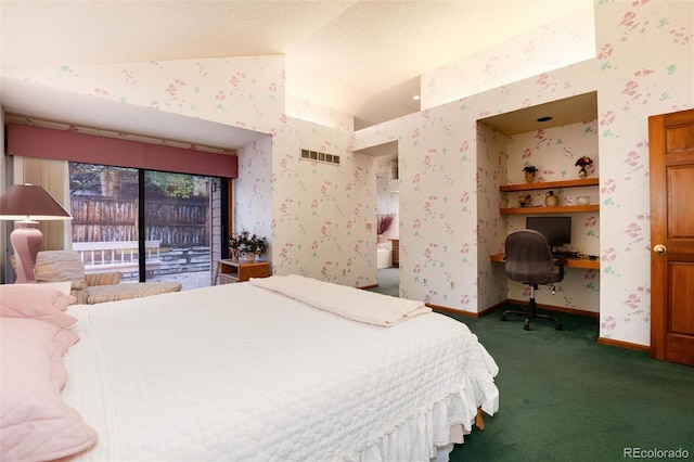 7500 E Dartmouth Ave Unit 16, Denver, CO 80231 - bedroom featuring dark colored carpet, vaulted ceiling, baseboards, wallpapered walls, and access to outside