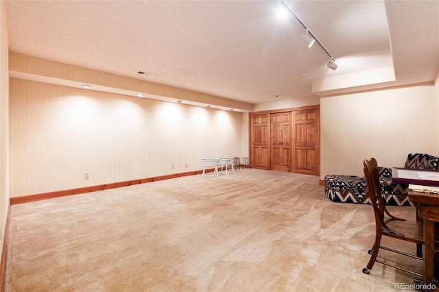 7500 E Dartmouth Ave Unit 16, Denver, CO 80231 - finished below grade area featuring carpet flooring and rail lighting