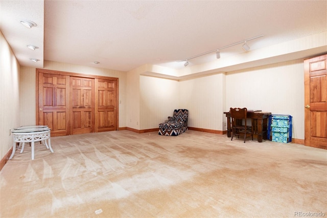 7500 E Dartmouth Ave Unit 16, Denver, CO 80231 - below grade area featuring track lighting, carpet flooring, and baseboards
