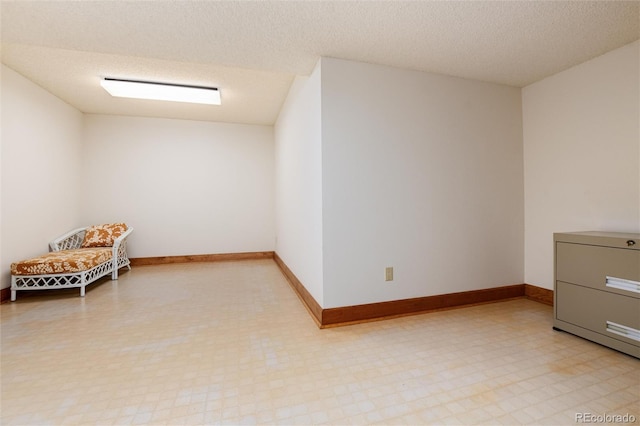 7500 E Dartmouth Ave Unit 16, Denver, CO 80231 - additional living space featuring a textured ceiling, baseboards, and light floors
