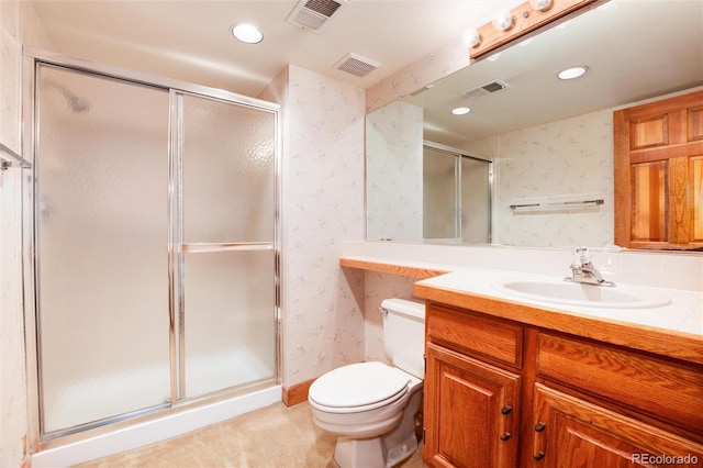 7500 E Dartmouth Ave Unit 16, Denver, CO 80231 - bathroom with wallpapered walls, a stall shower, toilet, recessed lighting, and vanity
