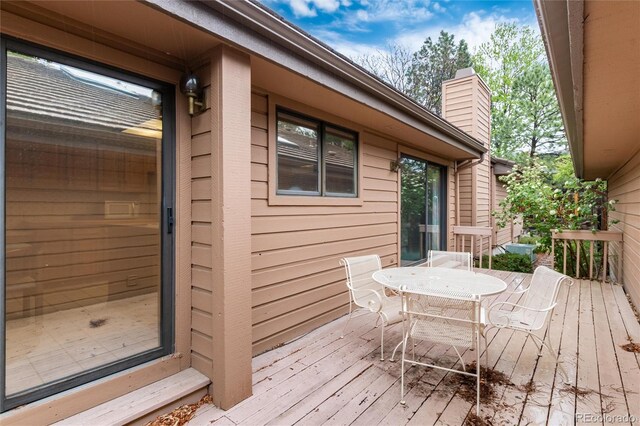 7500 E Dartmouth Ave Unit 16, Denver, CO 80231 - wooden deck with outdoor dining area
