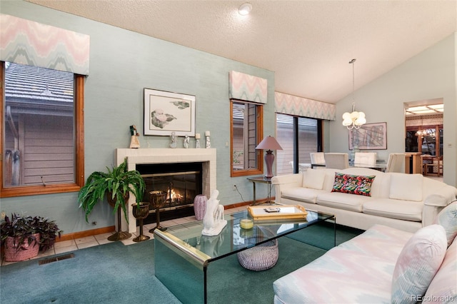 7500 E Dartmouth Ave Unit 16, Denver, CO 80231 - living room featuring a chandelier, lofted ceiling, a fireplace with flush hearth, baseboards, and carpet