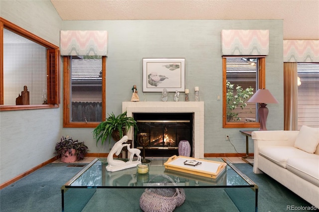 7500 E Dartmouth Ave Unit 16, Denver, CO 80231 - living area with baseboards, carpet floors, and a lit fireplace