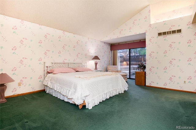7500 E Dartmouth Ave Unit 16, Denver, CO 80231 - bedroom with wallpapered walls, carpet flooring, vaulted ceiling, access to outside, and baseboards