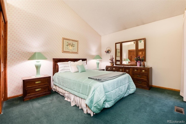 7500 E Dartmouth Ave Unit 16, Denver, CO 80231 - bedroom featuring vaulted ceiling, carpet flooring, wallpapered walls, and baseboards