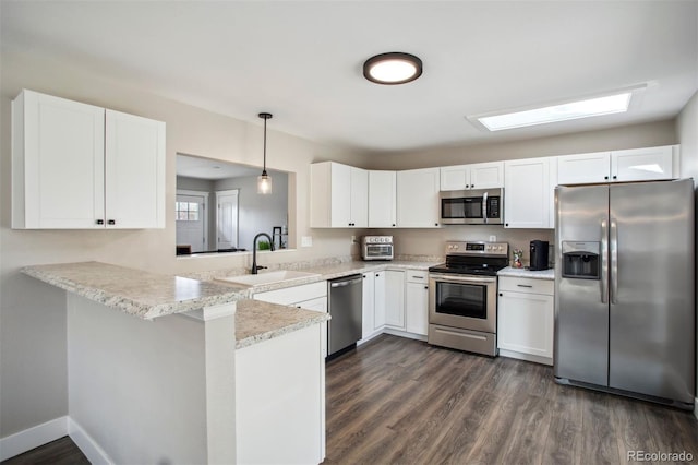 kitchen featuring white cabinets, a sink, and stainless steel appliances