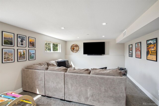 carpeted living area with baseboards, visible vents, and recessed lighting