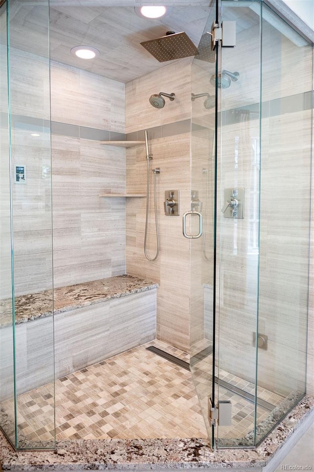 full bathroom with a shower stall