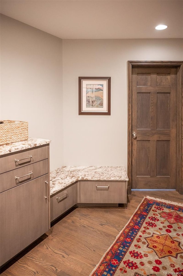 interior space featuring dark wood finished floors and recessed lighting