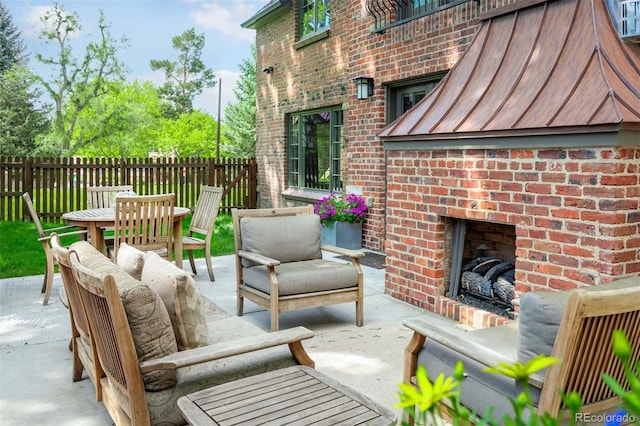 290 Dexter St, Denver, CO 80220 - view of patio / terrace with an outdoor living space with a fireplace