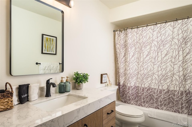 full bathroom with vanity, toilet, and shower / bath combo with shower curtain