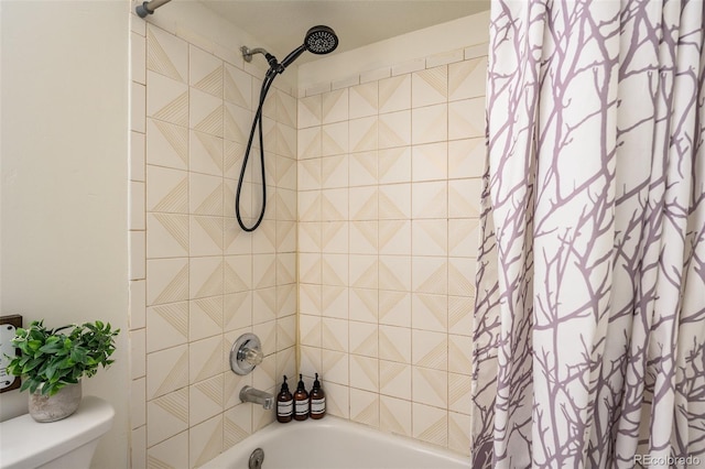 bathroom featuring shower / tub combo with curtain and toilet