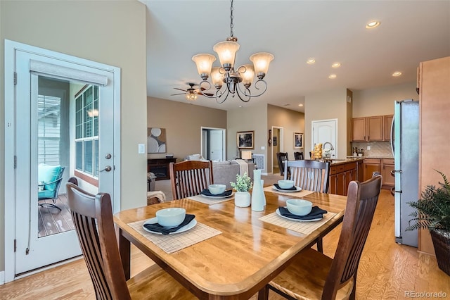 15852 Lavender Pl, Broomfield, CO 80023 - dining space featuring a chandelier, light wood-style flooring, ceiling fan, and recessed lighting