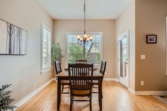 15852 Lavender Pl, Broomfield, CO 80023 - dining room featuring light wood-type flooring, plenty of natural light, and a chandelier