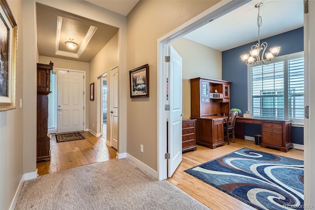 15852 Lavender Pl, Broomfield, CO 80023 - foyer with light wood-style floors, a chandelier, and light carpet