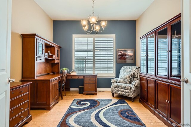 15852 Lavender Pl, Broomfield, CO 80023 - office featuring light wood-style floors, a chandelier, and built in study area
