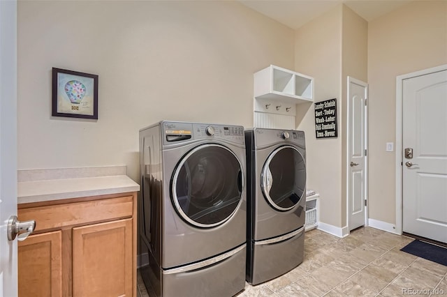 15852 Lavender Pl, Broomfield, CO 80023 - laundry room featuring washer and clothes dryer and cabinet space