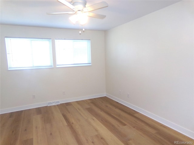 unfurnished room featuring wood-type flooring and ceiling fan