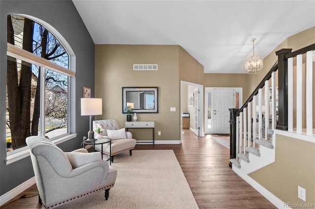 11991 Hazy Hills Dr, Parker, CO 80138 - interior space featuring visible vents, baseboards, a chandelier, stairway, and wood finished floors