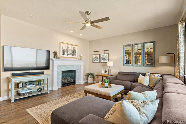 11991 Hazy Hills Dr, Parker, CO 80138 - living area featuring baseboards, ceiling fan, recessed lighting, wood finished floors, and a glass covered fireplace