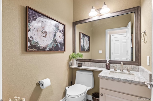 11991 Hazy Hills Dr, Parker, CO 80138 - bathroom featuring a textured wall, vanity, and toilet