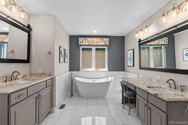 11991 Hazy Hills Dr, Parker, CO 80138 - full bath with a sink, a freestanding tub, and a healthy amount of sunlight