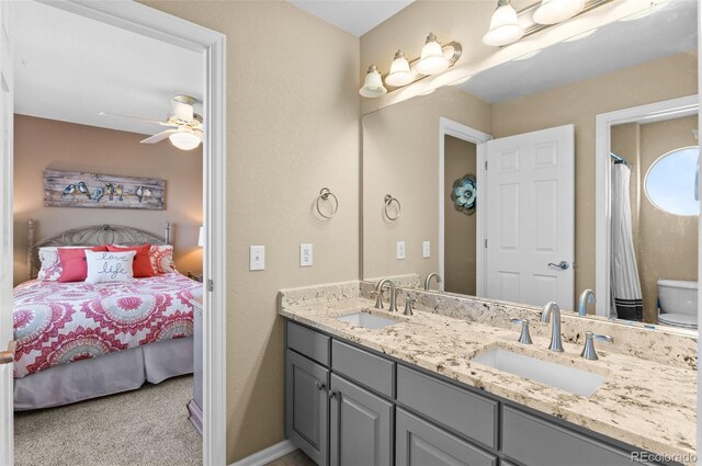 11991 Hazy Hills Dr, Parker, CO 80138 - bathroom featuring double vanity, a sink, a ceiling fan, and connected bathroom